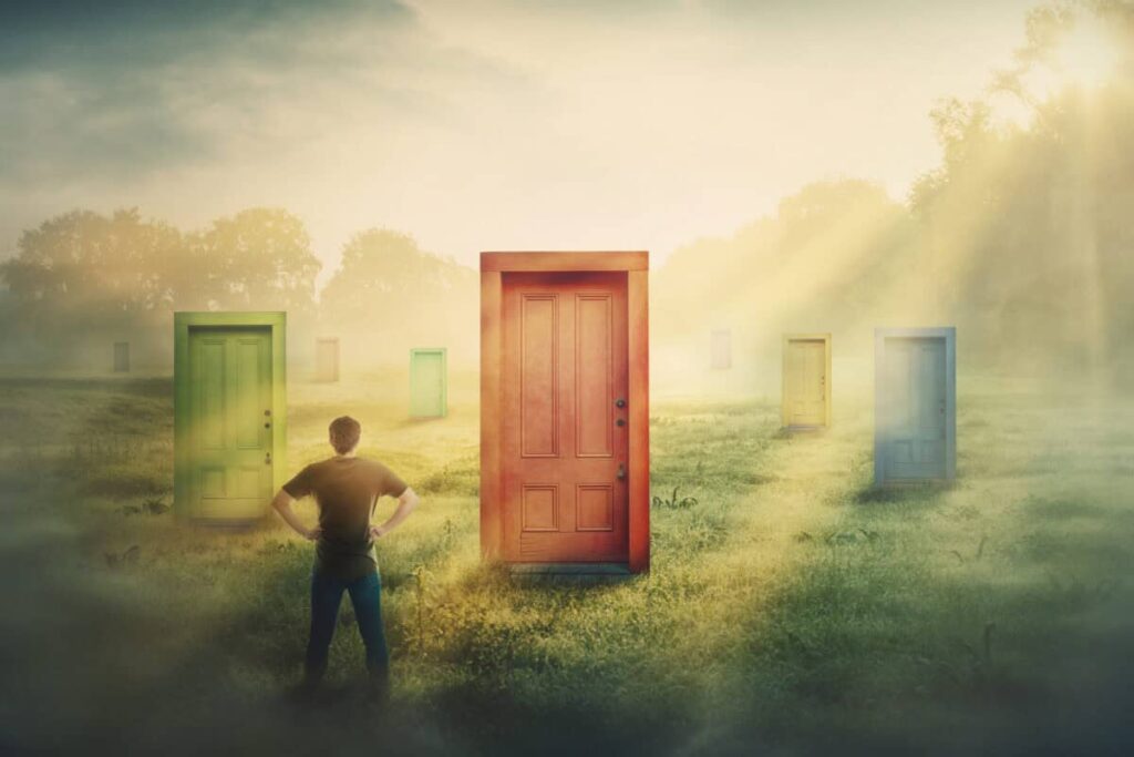 1 of the Most Overlooked Stocks on the TSX Right Now Canadian investor contemplating U.S. stocks with multiple doors to choose from.