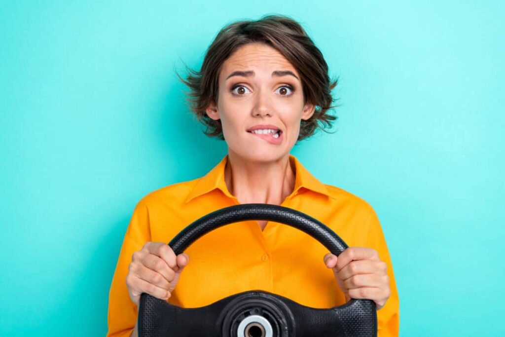 Is Having a $109,000 TFSA Actually Realistic for the Average Canadian? woman holding steering wheel is nervous about the future