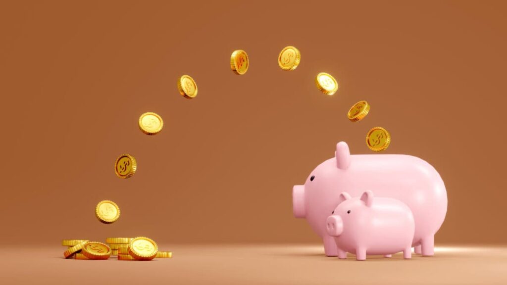 This TSX Stock Yields More Than the Average Savings Account Today coins jump into piggy bank